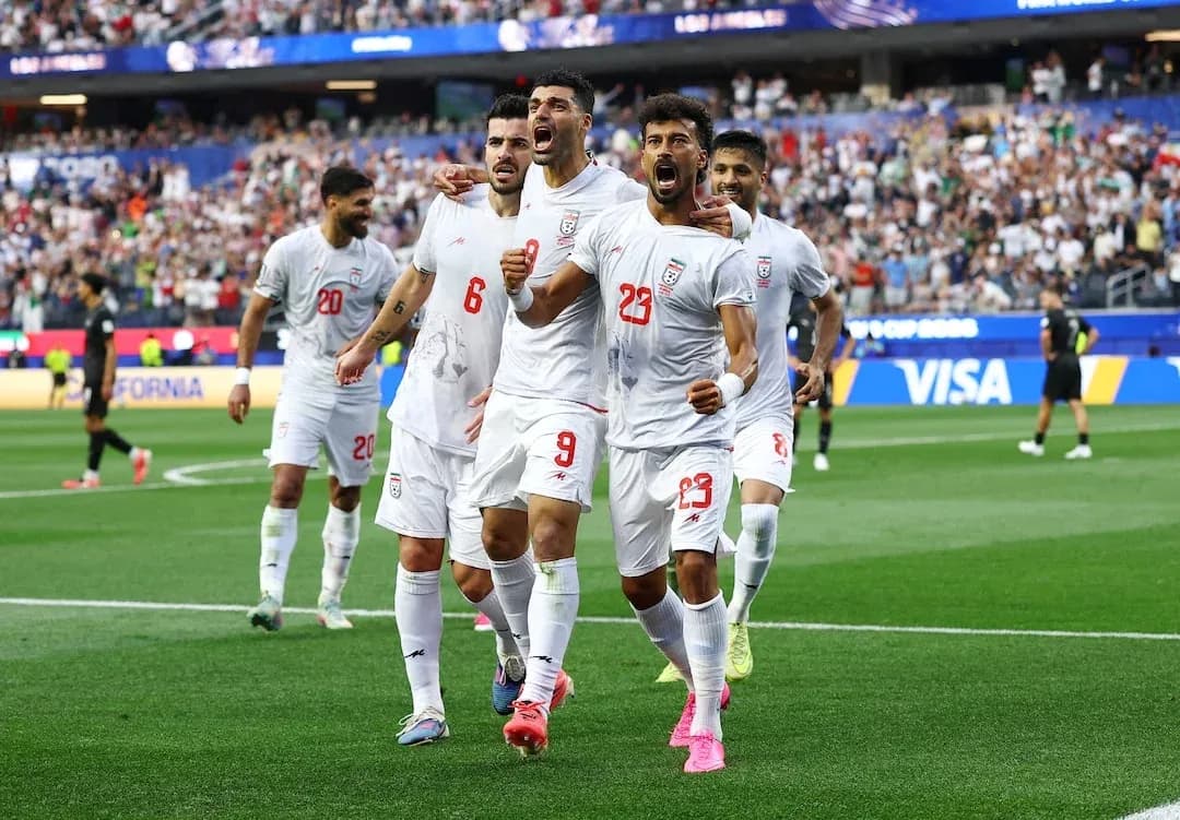 Iran players celebrating during a football match
