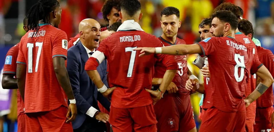 Portugal players discussing strategy during match