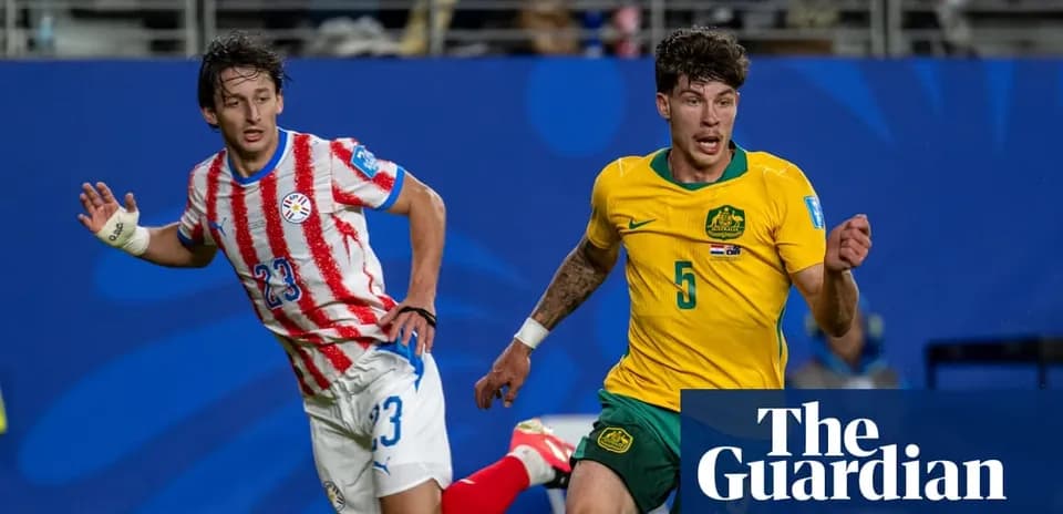 Players from Paraguay and Australia competing for the ball