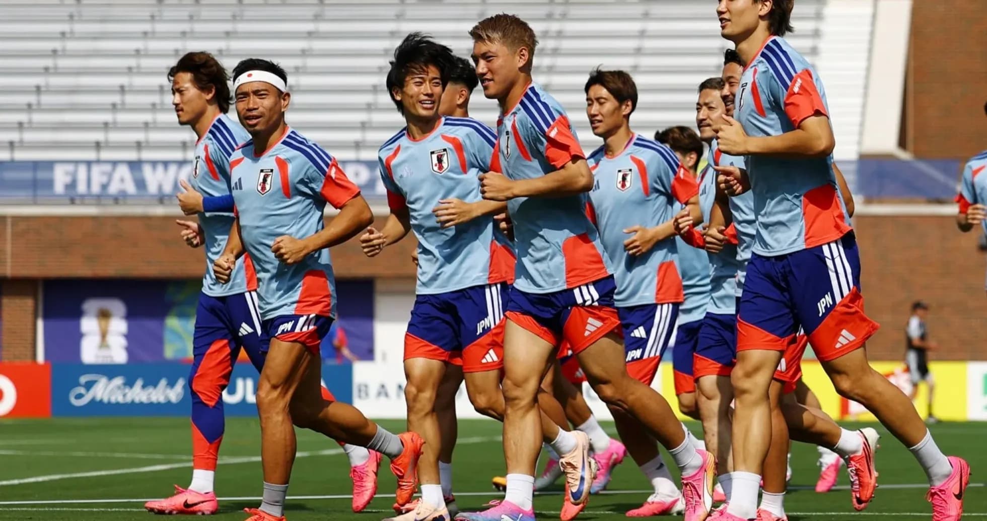 Japan national team players jogging during training session