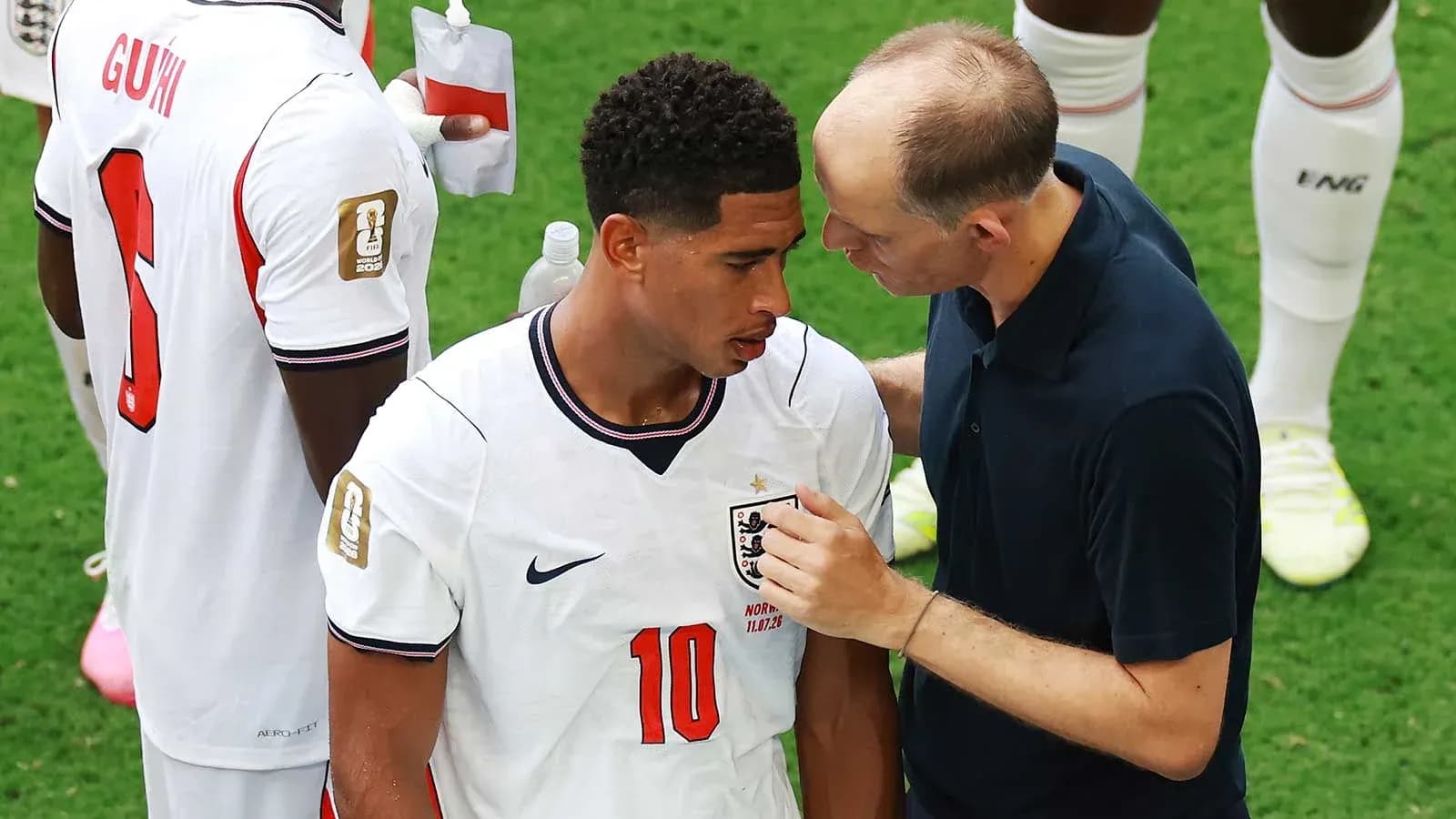 Player receiving advice from coach during match Player receiving advice from coach during match