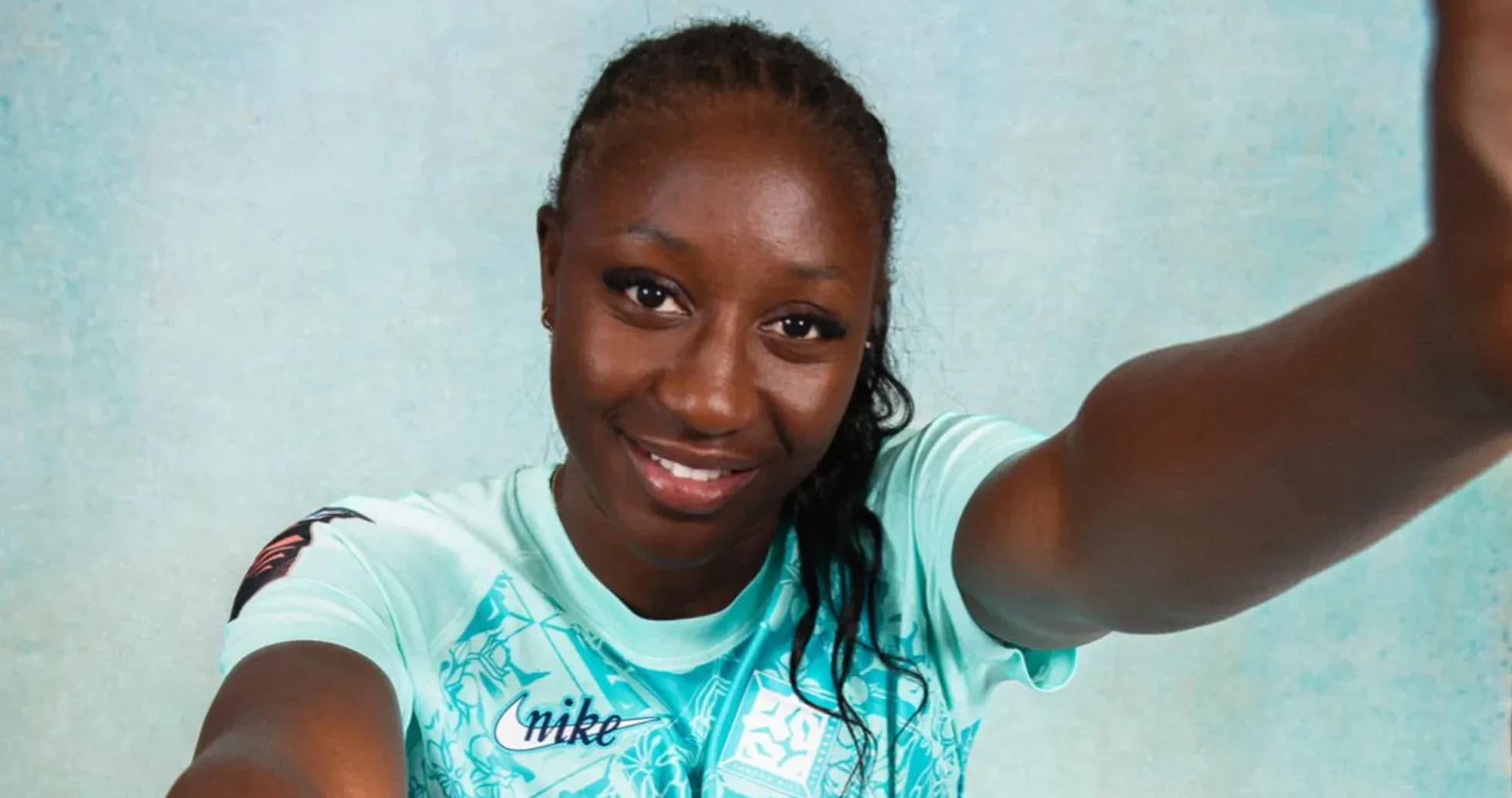 Athlete posing for a selfie in team jersey
