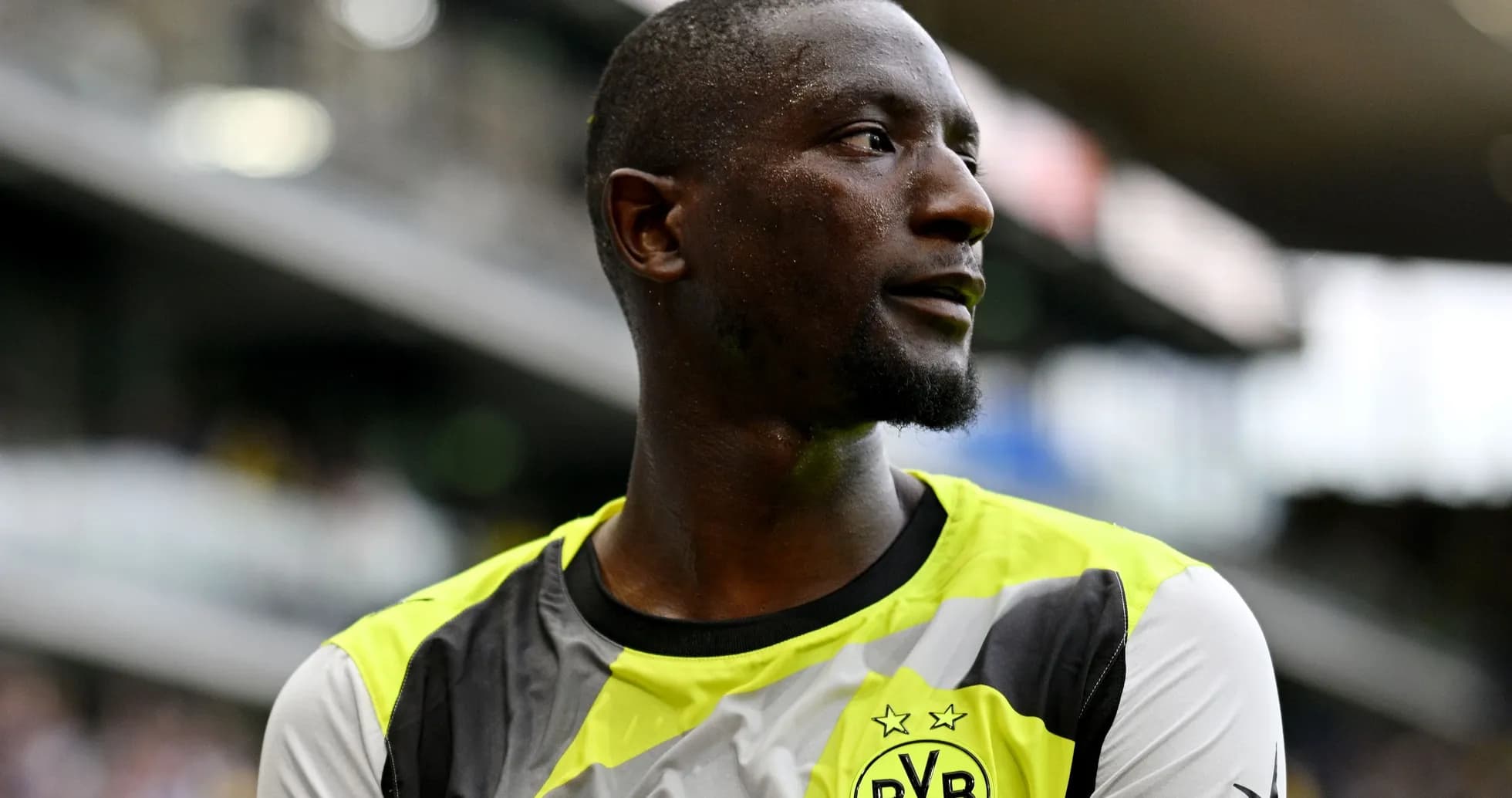 Player wearing Borussia Dortmund jersey on the field