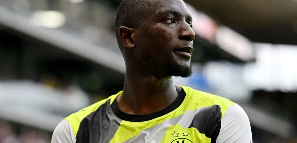 Player wearing Borussia Dortmund jersey on the field