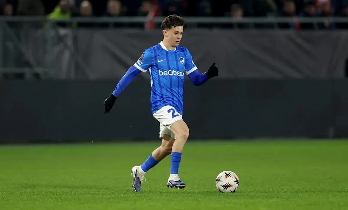 Player in blue jersey dribbling a soccer ball