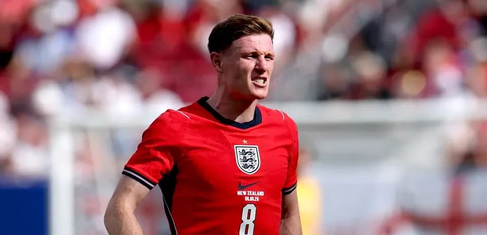 Player wearing red England jersey during match