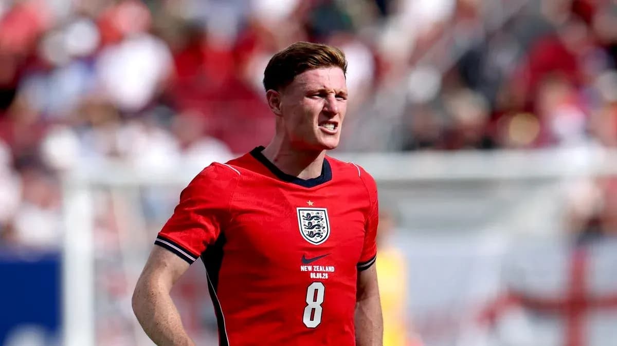 Player wearing red England jersey during match