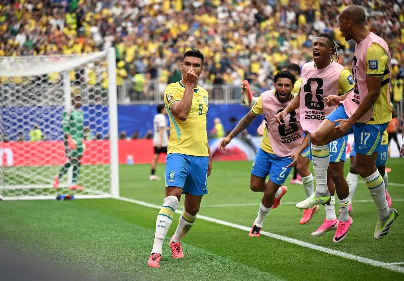 Brazil players celebrating a goal during World Cup match