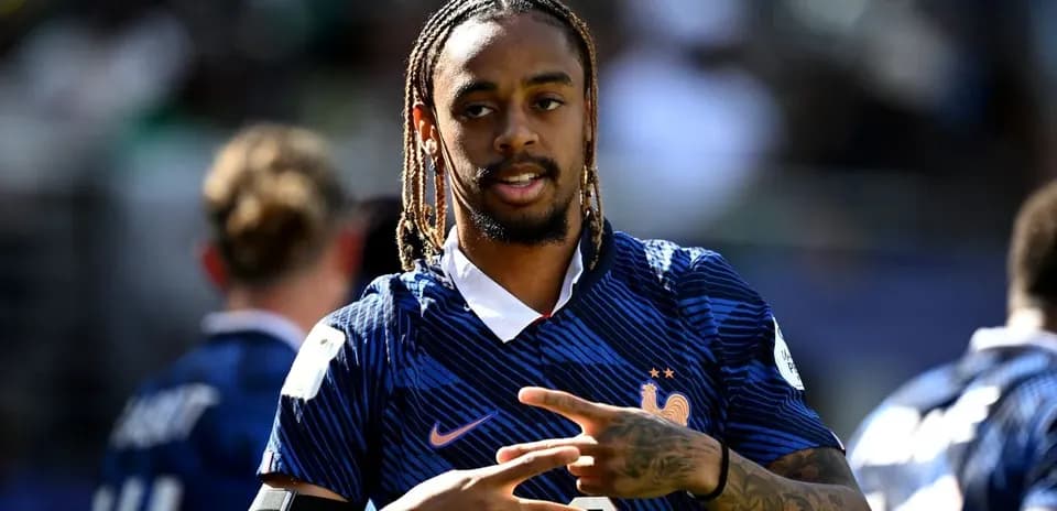 Player in France jersey gestures during warm-up