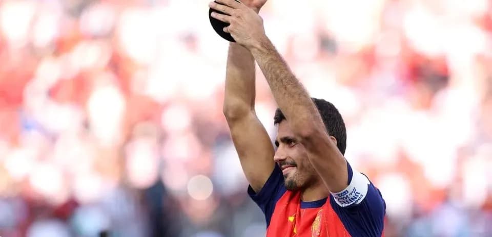 Player celebrating with trophy after winning tournament