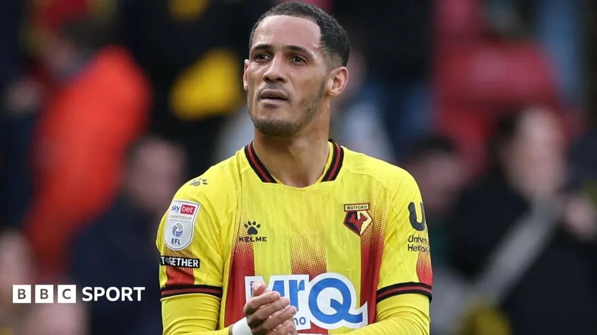 Watford player applauding fans after a match