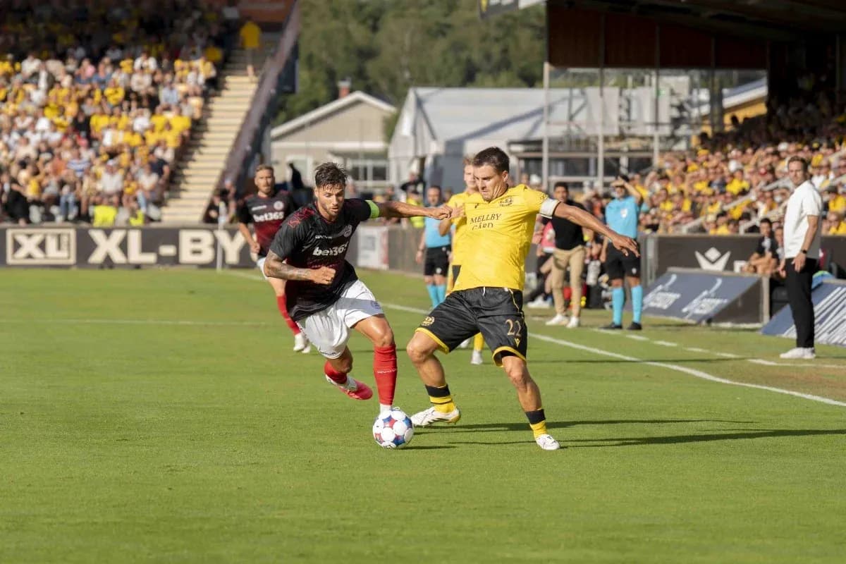 Players contesting for the ball in match