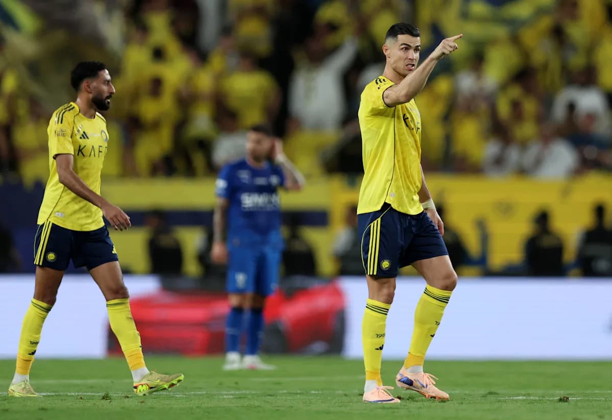 Two players in yellow jerseys during a match
