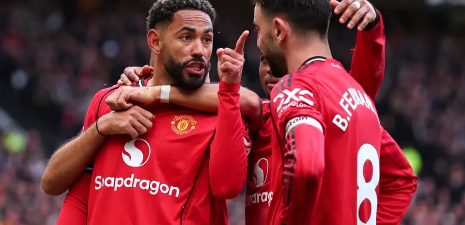 Manchester United players celebrating during a match