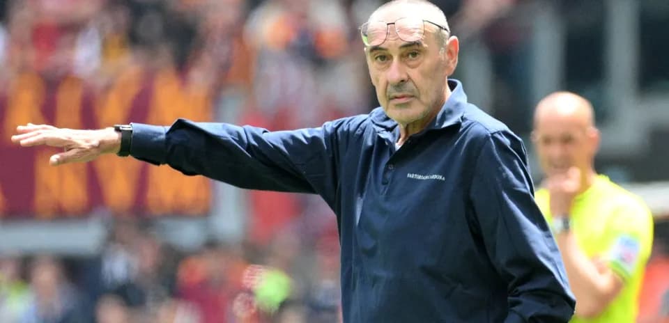 Manager gesturing during a match on the sidelines