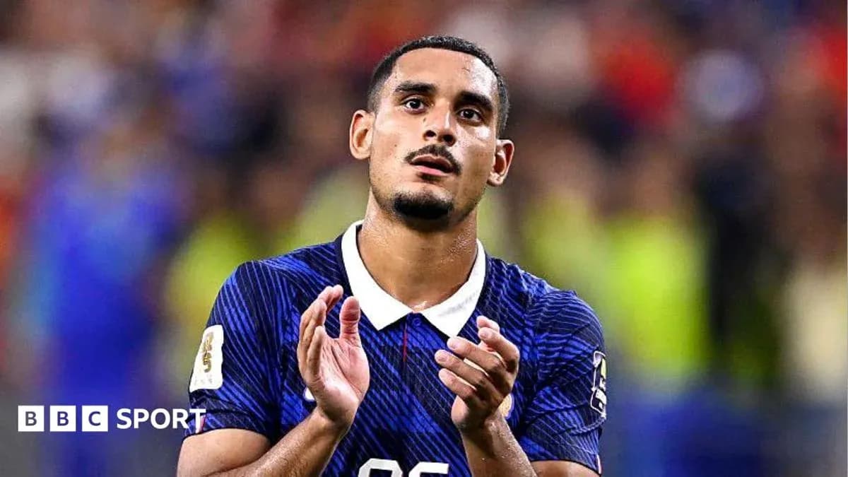 Player applauding fans after match in stadium