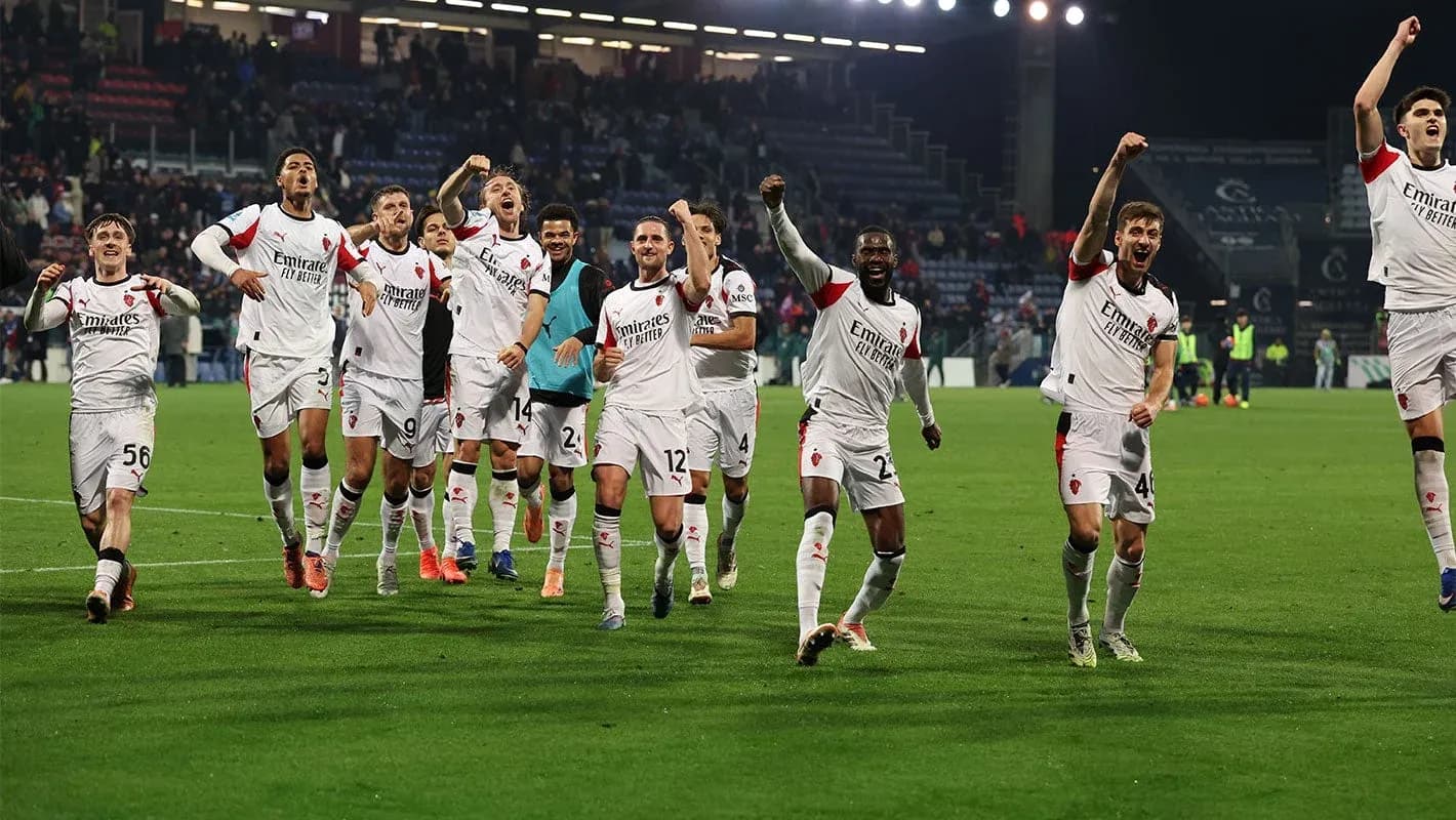 AC Milan players celebrating victory on the pitch