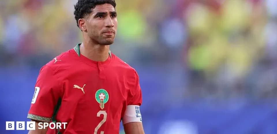 Player in red Morocco jersey on the field