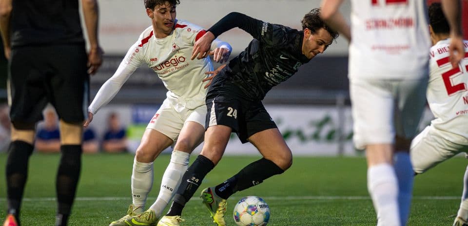 Players contesting for the ball in football match