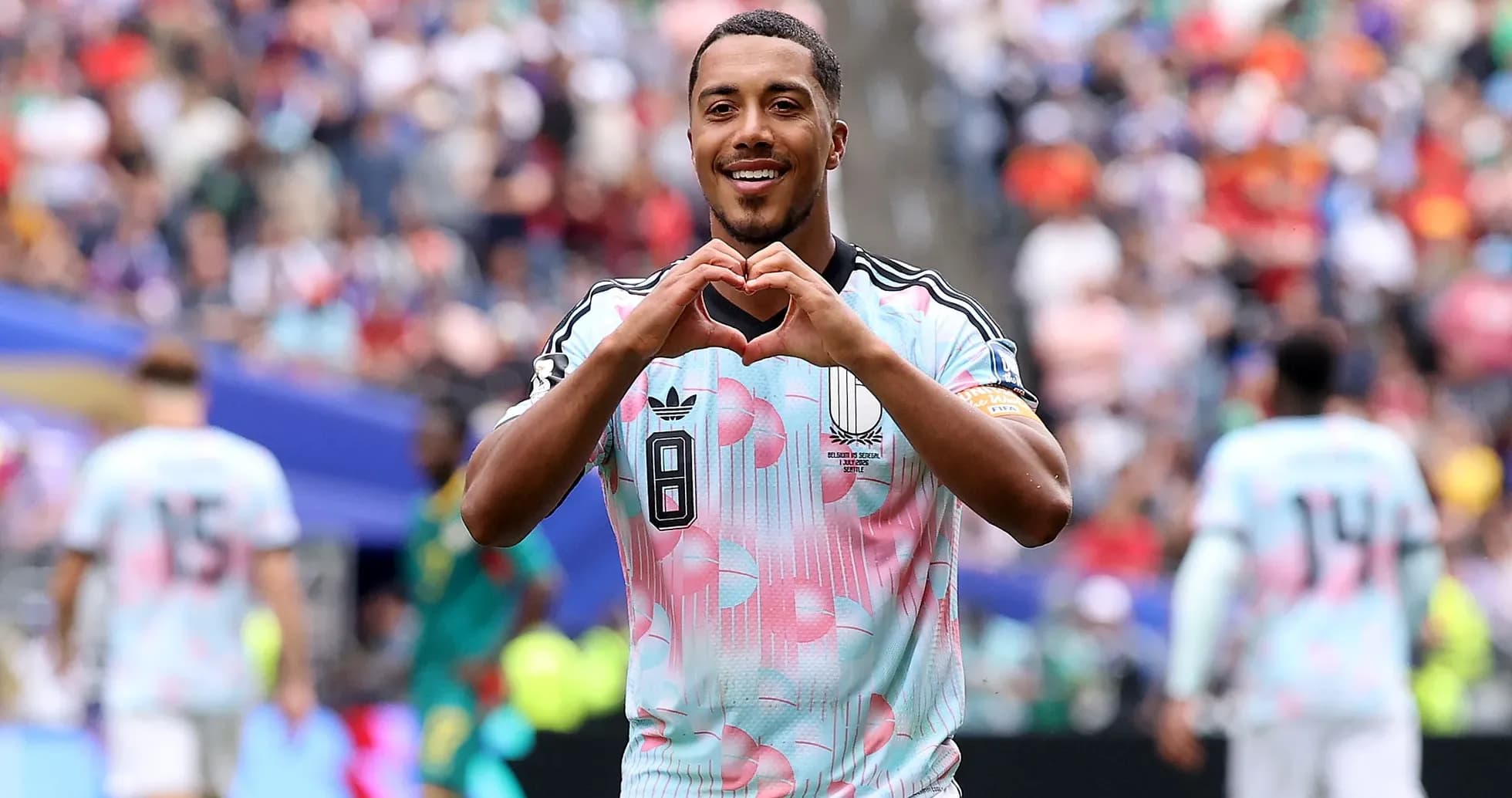 Player making heart gesture after scoring goal