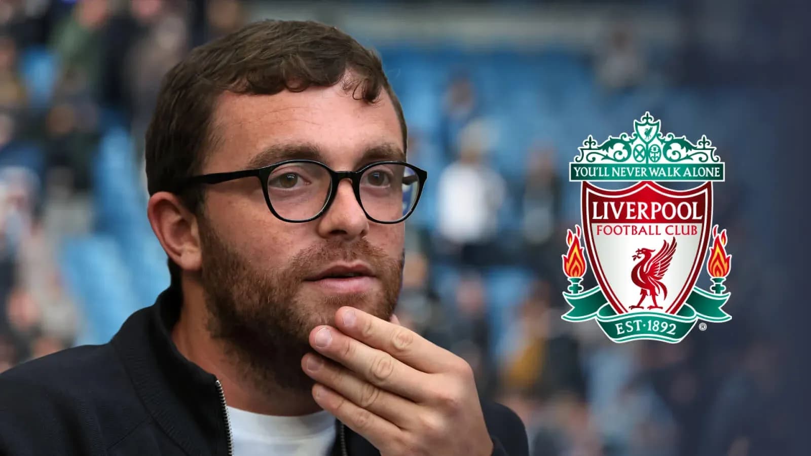 Man in glasses contemplating at Liverpool match
