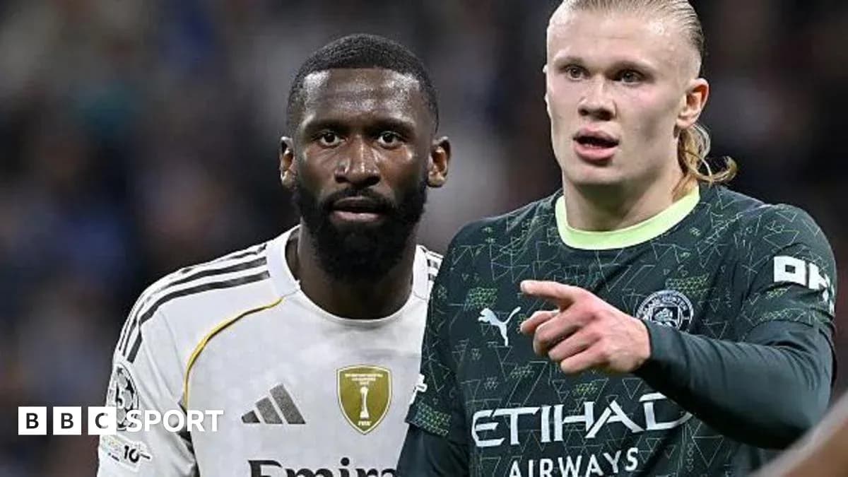 Two football players discussing during a match