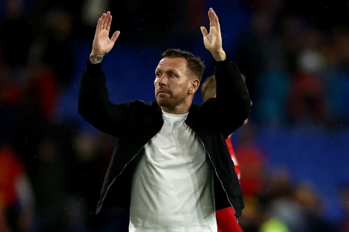 Man gesturing to crowd after match conclusion