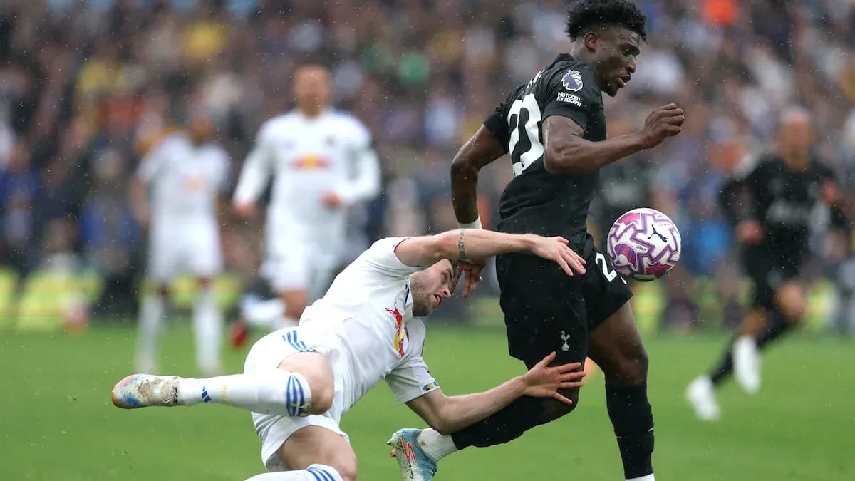 Player tackling opponent during intense football match