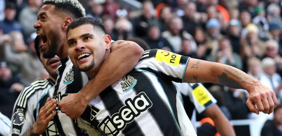Newcastle players celebrating a goal during match