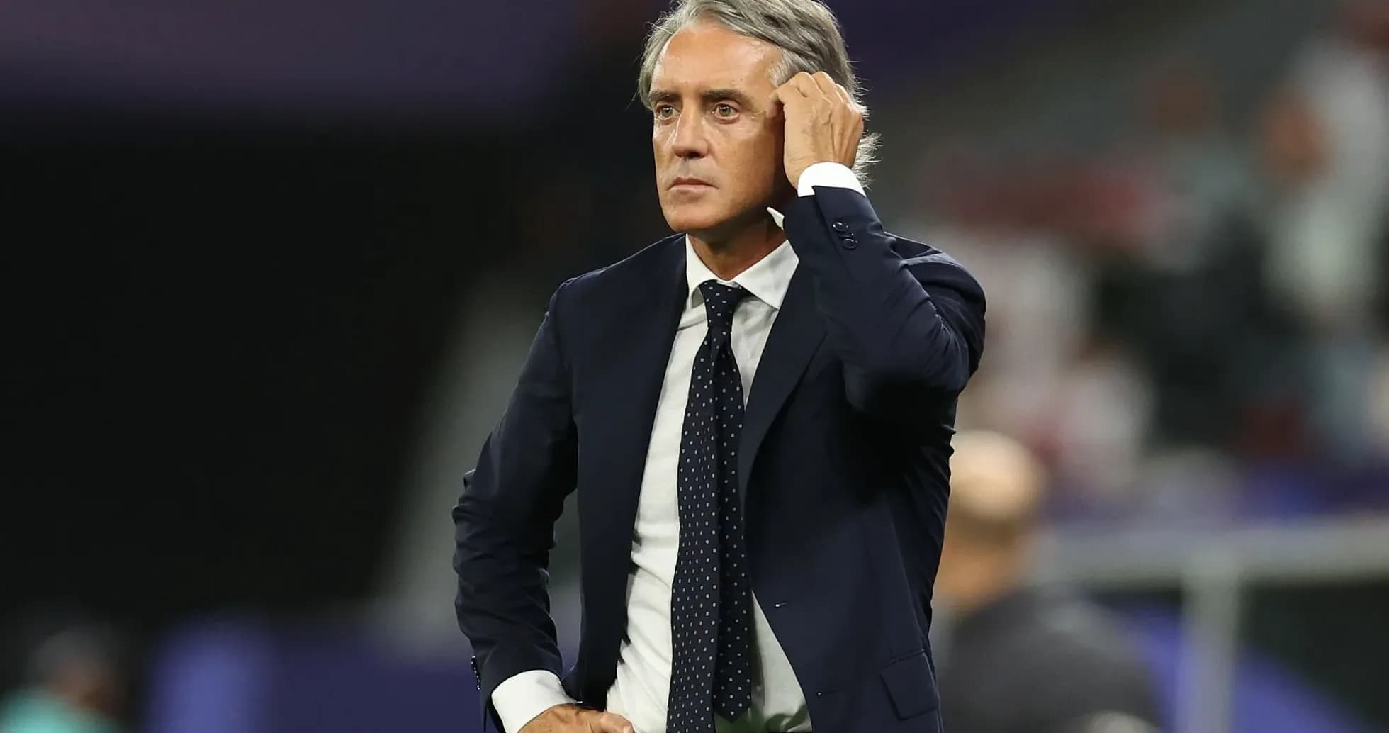 Manager observing match from the sidelines