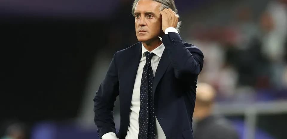 Manager observing match from the sidelines