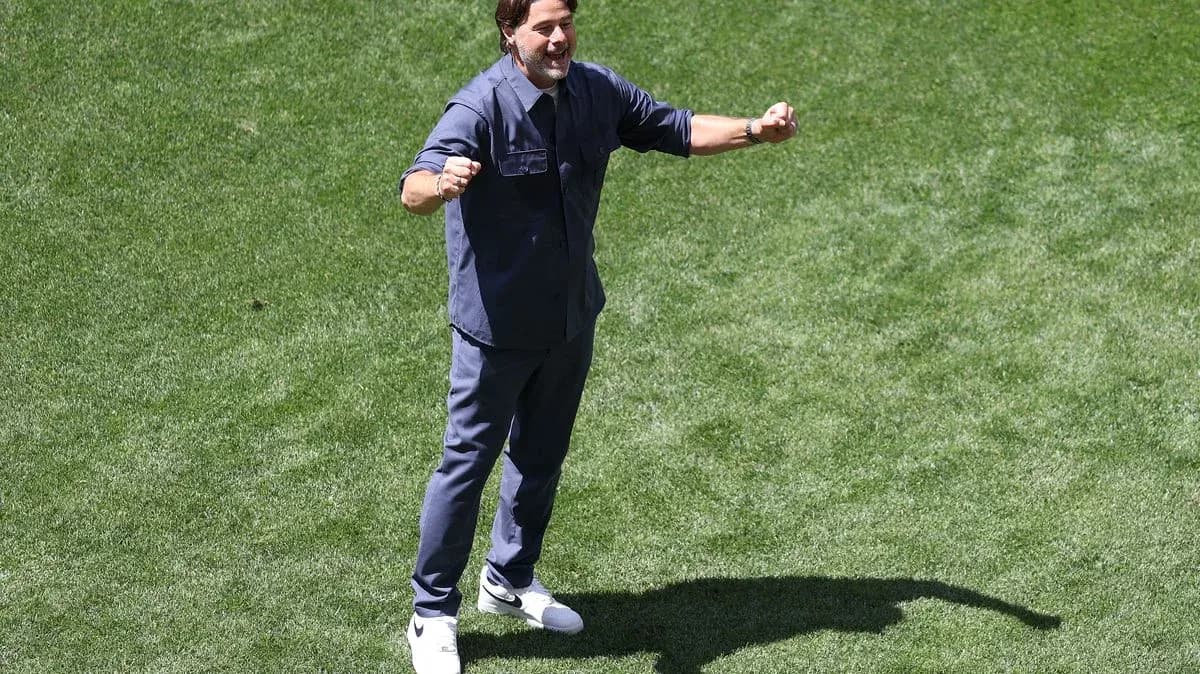 Coach celebrating on the field during training
