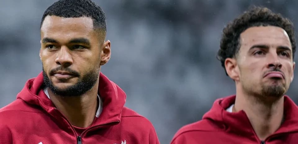 Two Liverpool players in training attire before match
