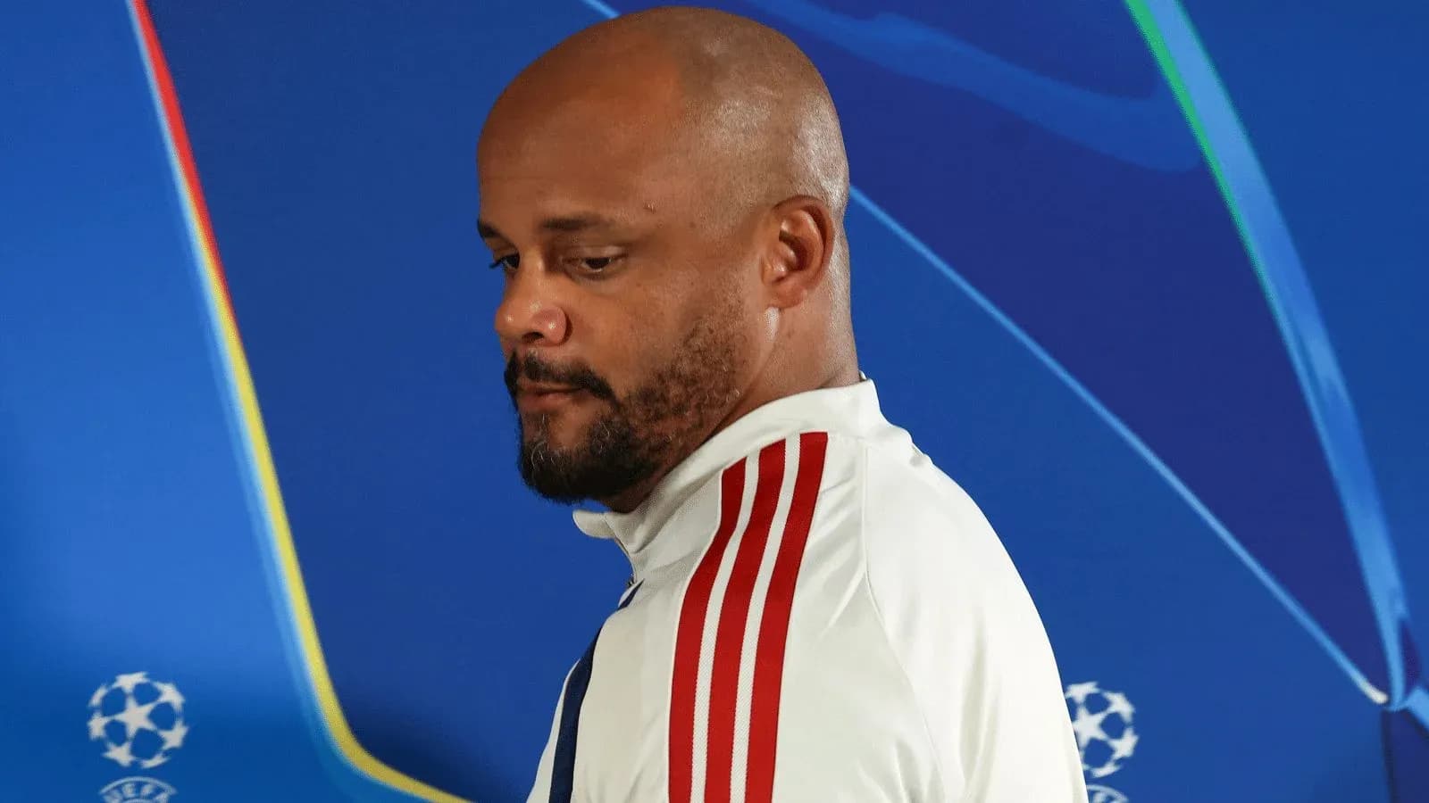 Person standing before a Champions League backdrop