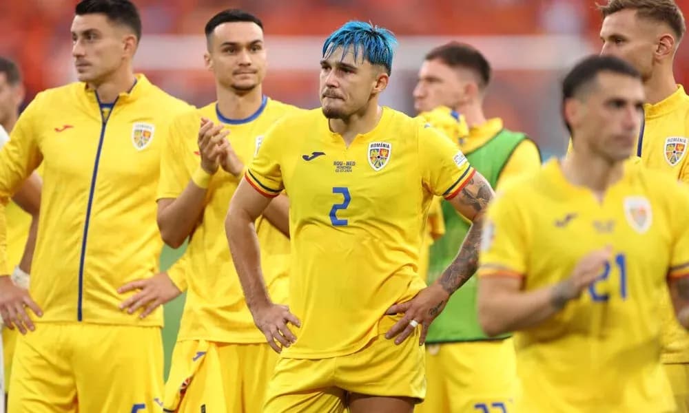 Romania players in yellow uniforms after match