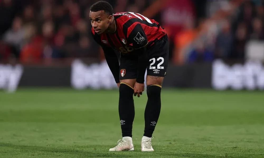 AFC Bournemouth player bending over on the pitch