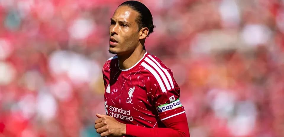 Player in Liverpool kit during match warm-up