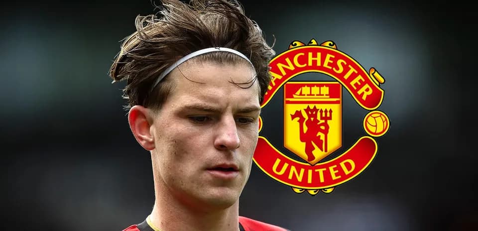 Player with headband in front of Manchester United logo
