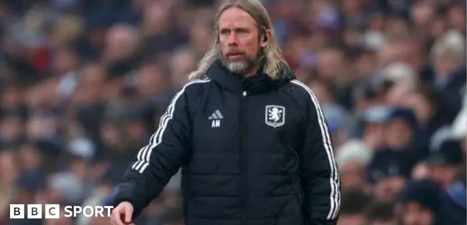 Manager directing players from the sidelines during match