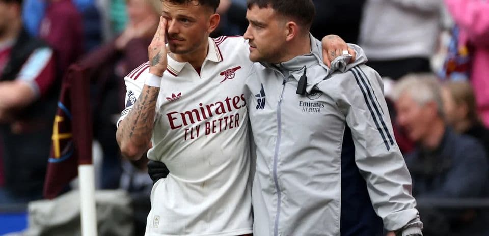 Player receiving support from staff after match