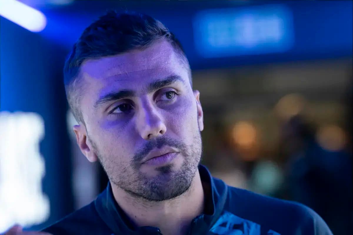 Athlete speaking during an event with blue lighting
