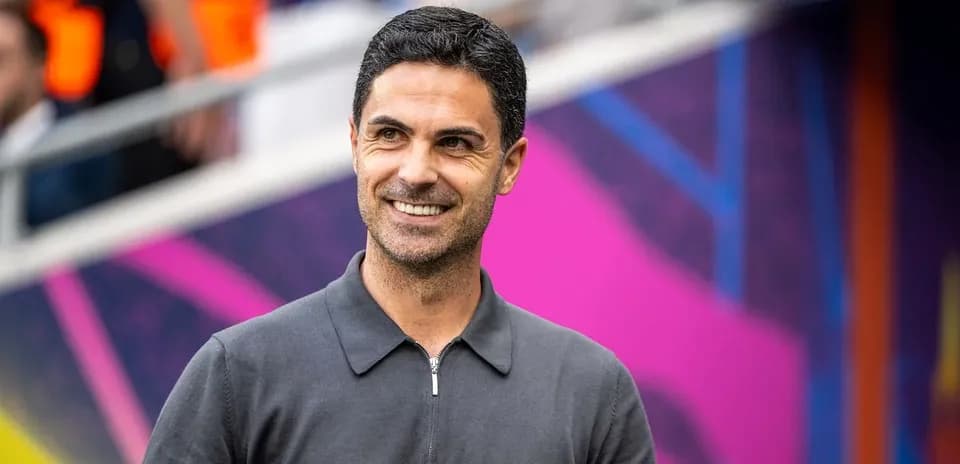 Coach smiling during pre-match preparations