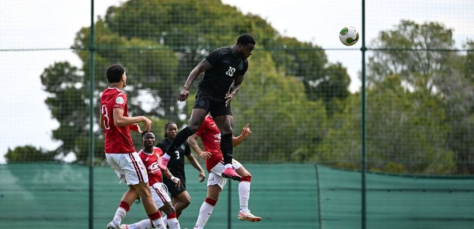 Player jumping to head the ball during training session
