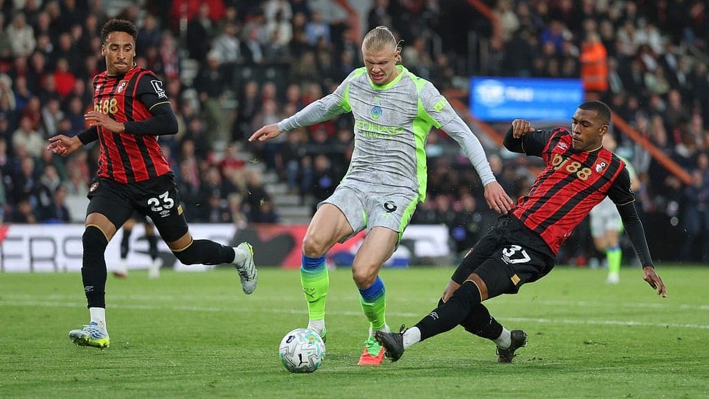 Players competing for the ball in Premier League match