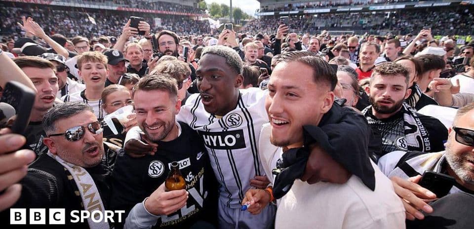 Fans celebrating with players on the field