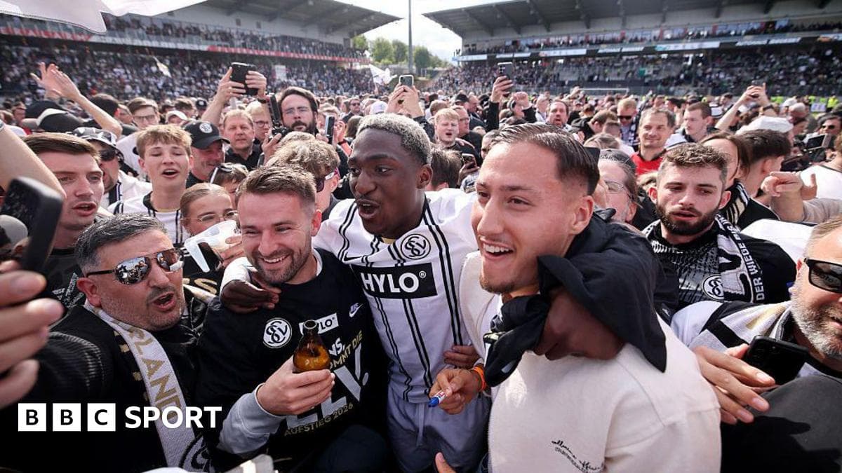 Fans celebrating with players on the field