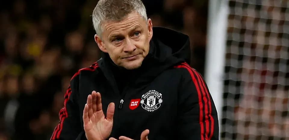 Manager gesturing during a match on the sideline