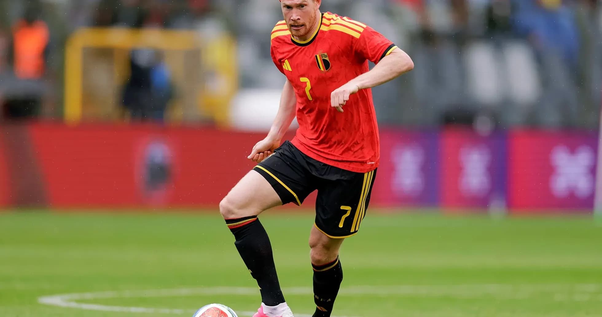 Belgian player dribbling during football match