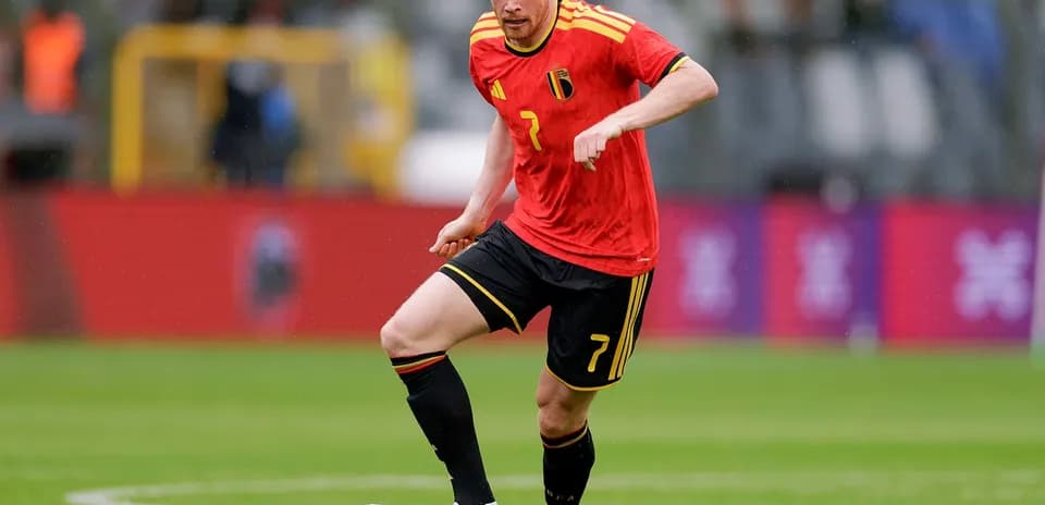 Belgian player dribbling during football match