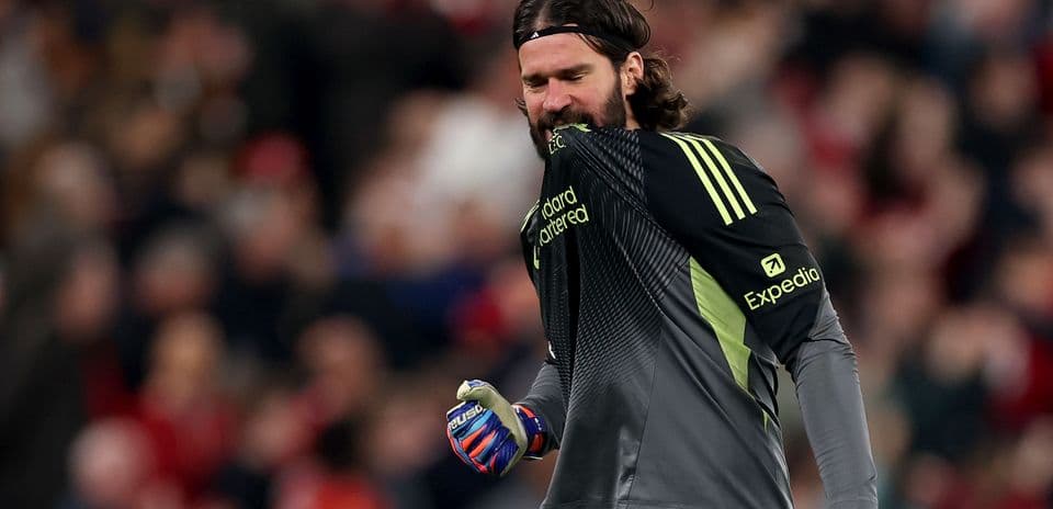 Goalkeeper celebrating with gloves during match